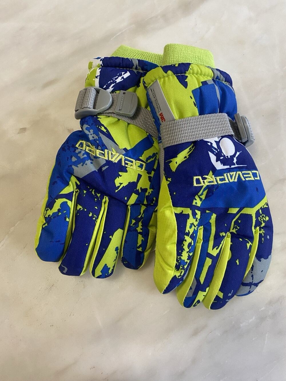 new Cevapro kids' ski gloves feature a vibrant green and blue camouflage sz S